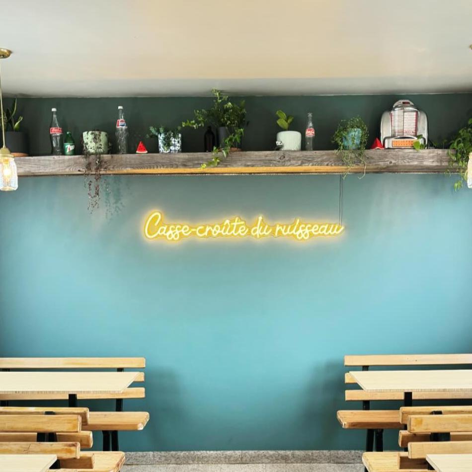 yellow neon sign featured in a restaurant